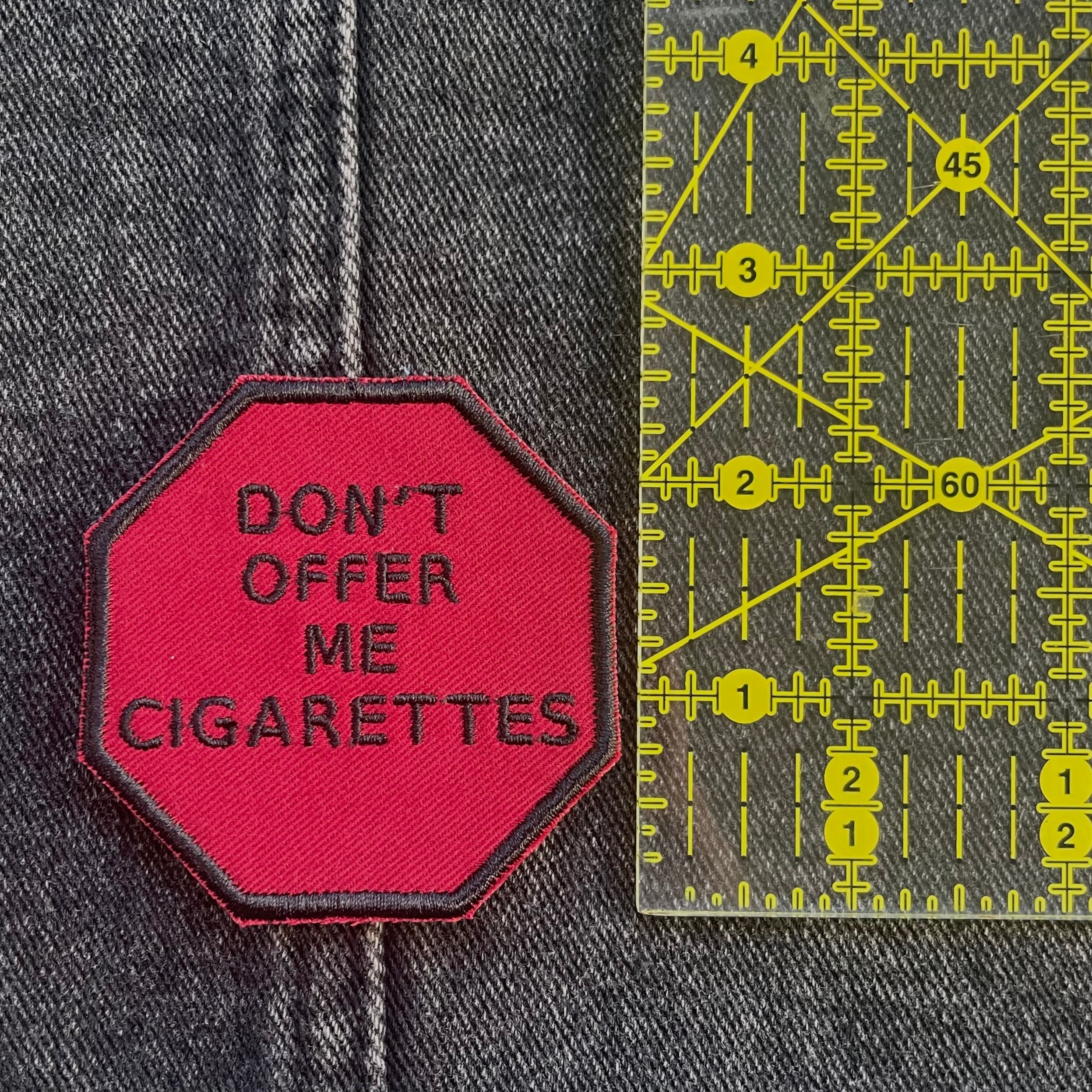 "Don't Offer Me Cigarettes," Stop Sign Patch