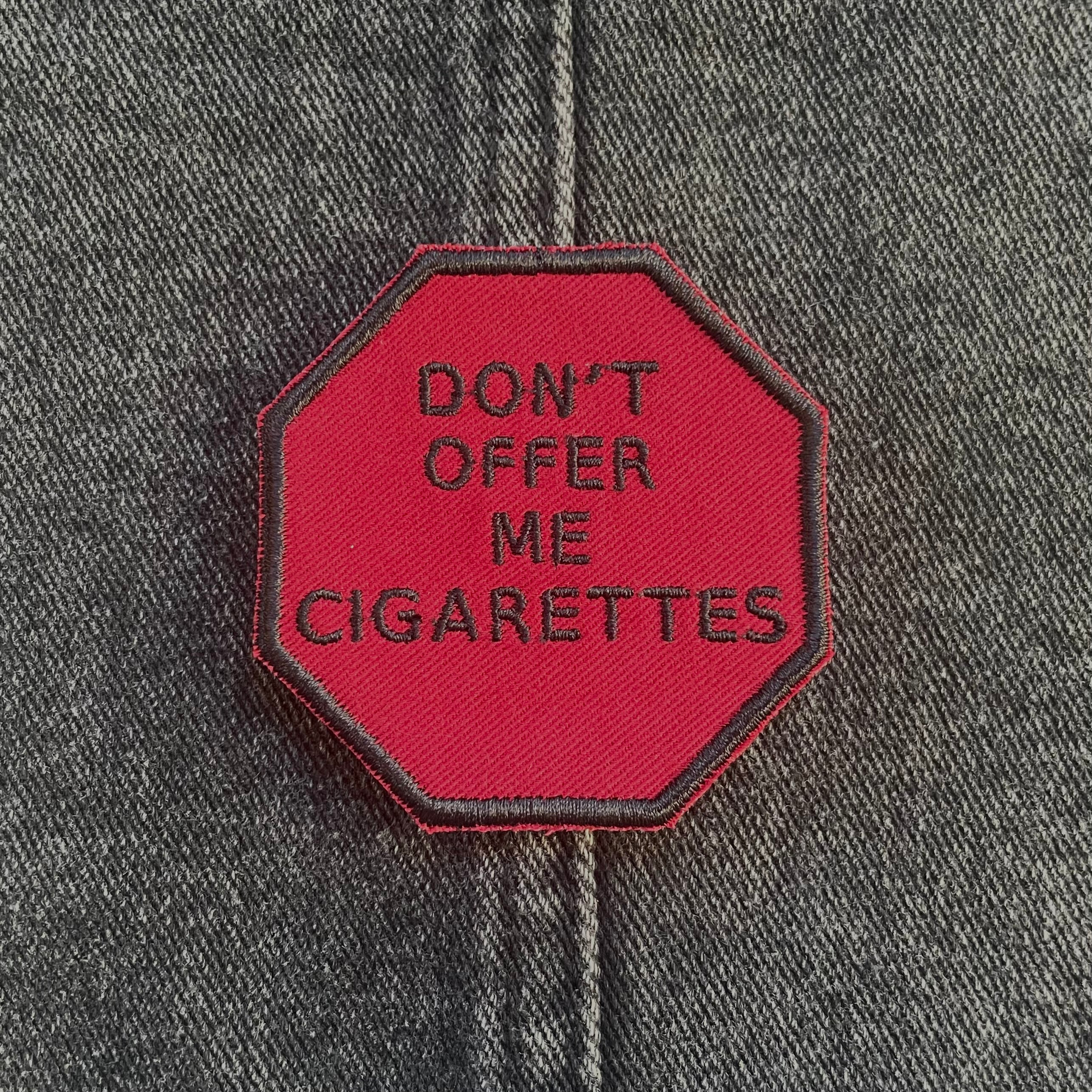 "Don't Offer Me Cigarettes," Stop Sign Patch