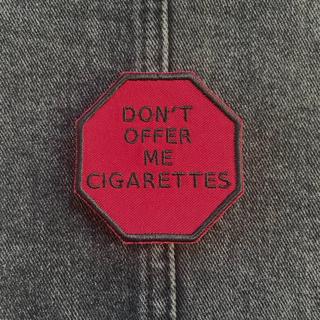 "Don't Offer Me Cigarettes," Stop Sign Patch